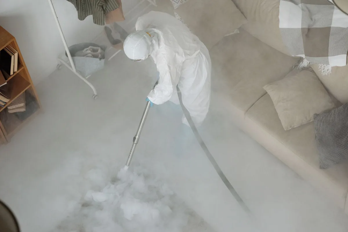 Biohazard cleanup technician in protective equipment, Groton, CT